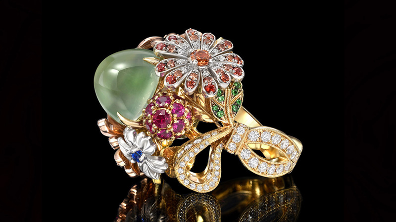 Supplier: Jewelry $10,001 to $50,000. Jack Ferrero Inc., Designed by Arman Agekyan. 18-karat yellow, white, and rose gold flower ring featuring a 9.44-carat green moonstone with white diamonds, fancy yellow diamonds, green garnet, ruby, and multi-colored sapphires ($27,000)