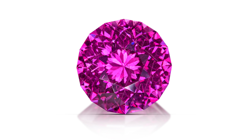 <b>Phenomenal, First Place.</b> Desmond Chan of Gem Arts International’s 14.90-carat hot pink to purple color-change modified round brilliant pyrope garnet titled “Cosmic Kaleidoscope”