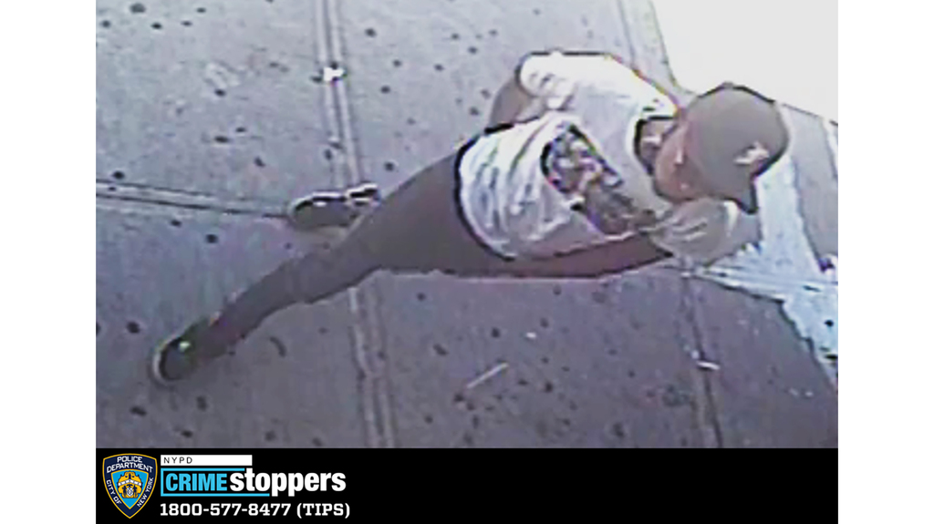 Pictured is the suspect who held the door open to let the thieves inside. Pictured is the suspect who held the door open to let the thieves inside.