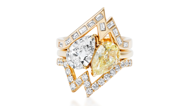 18-karat yellow gold ring and ring jackets with white and yellow diamonds. The pear-shaped white diamond center stone weighs 1.7 carats and the pear-shaped fancy yellow diamond weighs 1.85 carats. (price available upon request)
