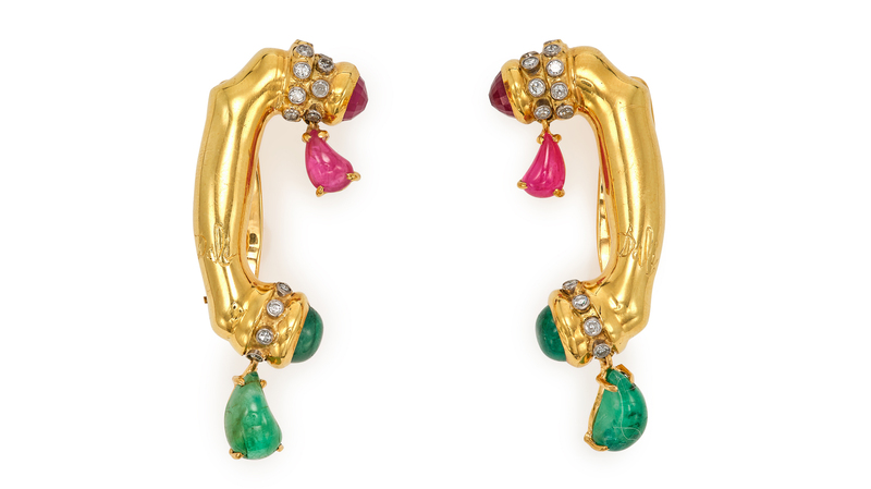 The earrings are crafted with 18-karat gold and gemstones.