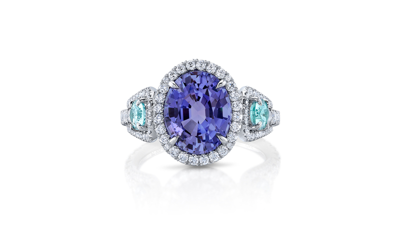 This Omi Privé platinum ring featuring a 4.81-carat oval-shaped purple sapphire accented by oval Paraíba-type tourmalines and round diamonds, fits Pantone’s Color of the Year.