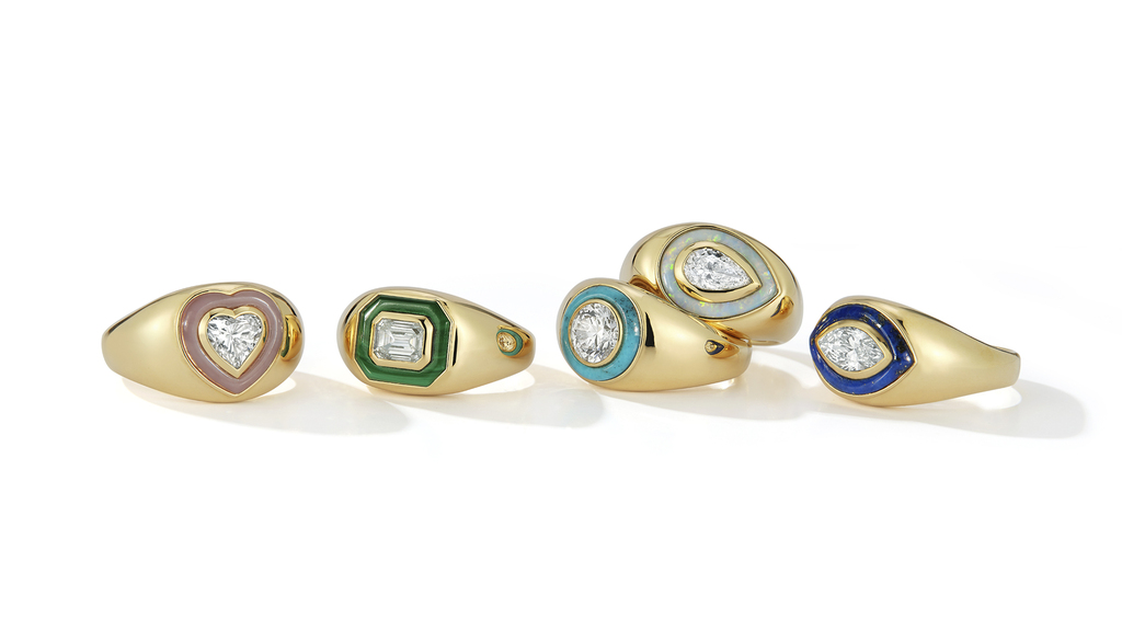 The “Bubble Ring” capsule collection from Maggi Simpkins consists of 1-carat diamonds (with the exception of the round diamond, which is 1.1 carats) set in 18-karat gold and framed by colored gemstone inlay. The pieces are, from left, the “Heart” framed by pink opal ($15,980 retail), the “Emerald” framed by malachite ($14,200), the “Round” framed by turquoise ($17,500), the “Pear” framed by opal ($14,980), and the “Marquise” framed by lapis lazuli $14,980).