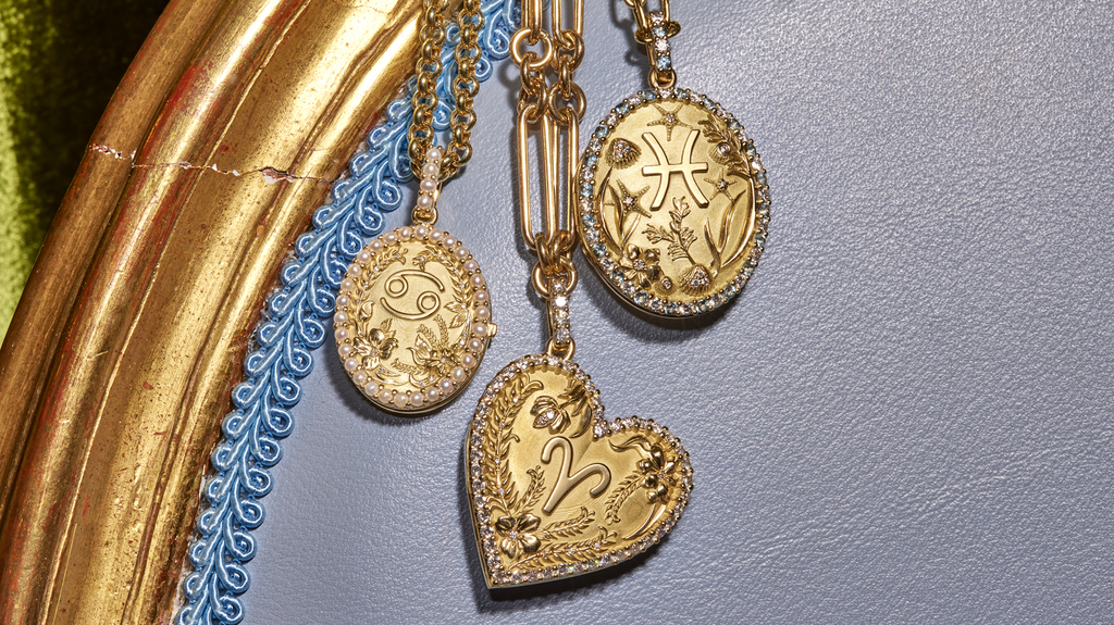 Pictured from left to right are Briony Raymond lockets representing Cancer, Aries, and Pisces.
