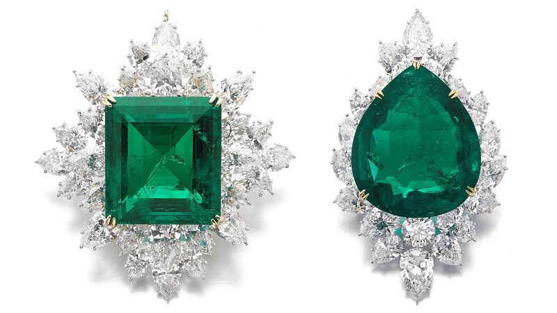 At left, an 80.45-carat step-cut Colombian emerald, which sold for $3.5 million, and at right, a 104.40-carat pear-shaped Colombian emerald, which went for $1.9 million.