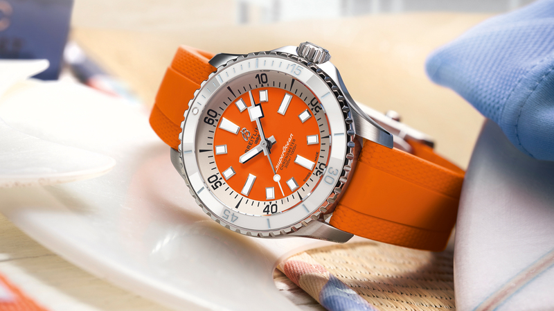 The Breitling SuperOcean Automatic 36 has a stainless steel case with choice of white, turquoise, or orange dial.