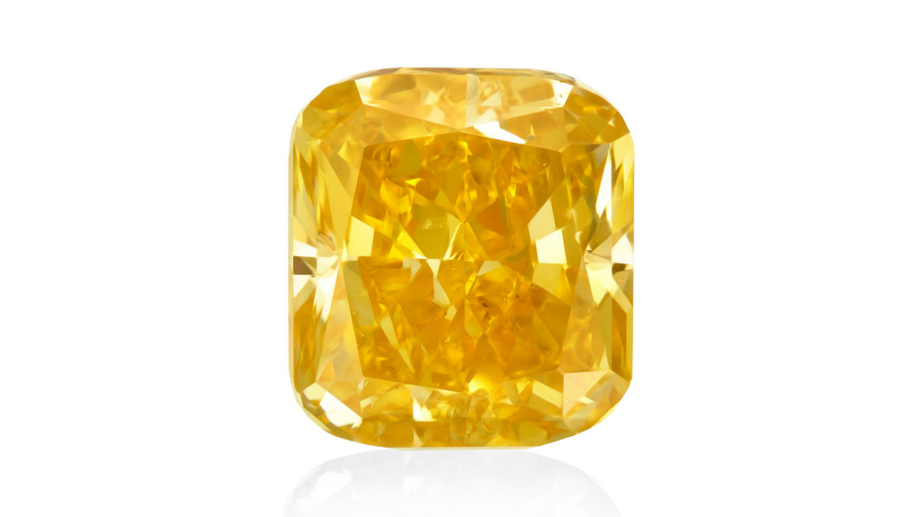 “The Summer Sunrise,” a 9.83-carat VS1 fancy vivid orange-yellow diamond ring, sold for $810,000 at Christie’s recent online-only jewelry auction.