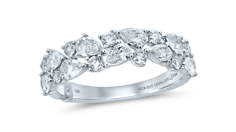 An 18-karat white gold 1.25-carat pear shape and round diamond band ($3,299.99). Each style has Lhuillier’s “XO” signature and her brand logo on the inside of the band.