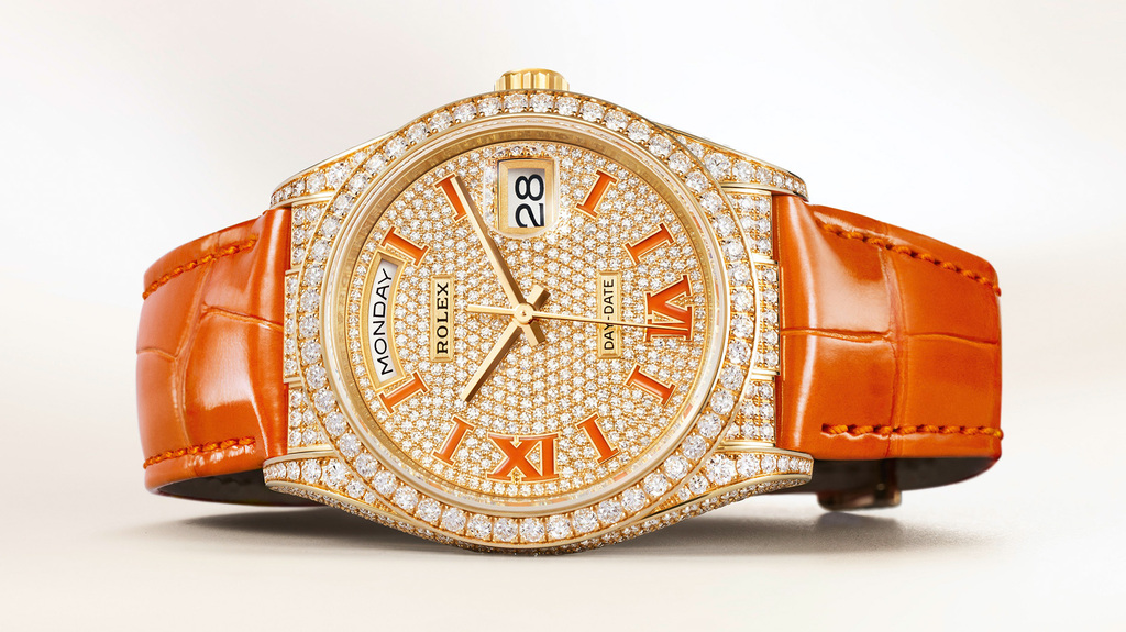 The diamond-set 18-karat yellow gold Day-Date 36 with the coral-colored alligator strap and markers retails for $82,500. The Everose with burgundy and the white gold version with turquoise are both $85,000. The diamond-set 18-karat yellow gold Day-Date 36 with the coral-colored alligator strap and markers retails for $82,500. The Everose with burgundy and the white gold version with turquoise are both $85,000.