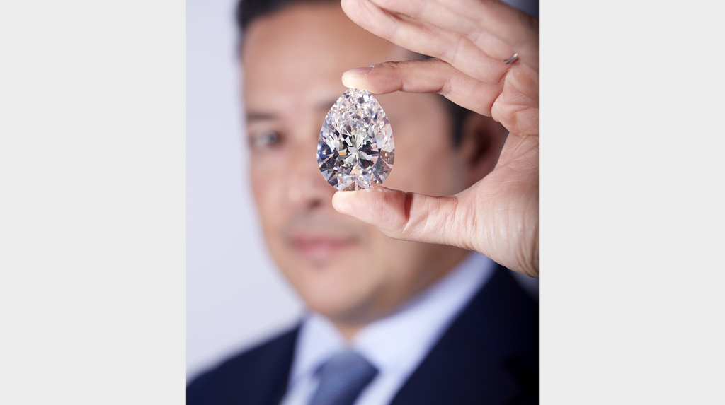 Here, Christie’s International Head of Jewelry Rahul Kadakia showcases the 228-carat “The Rock” diamond. Here, Christie’s International Head of Jewelry Rahul Kadakia showcases the 228-carat “The Rock” diamond.