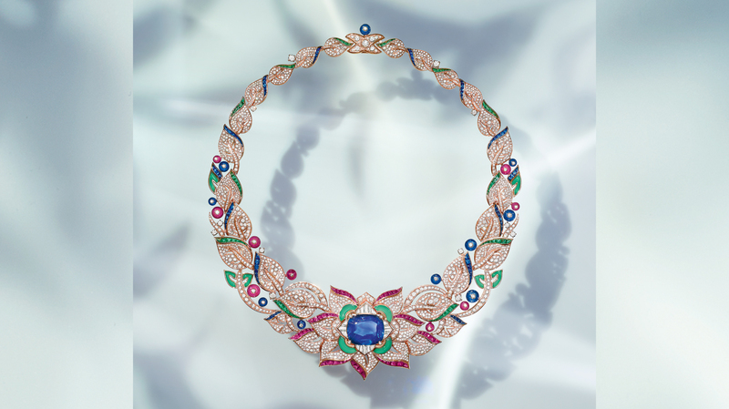 A pink gold necklace set with chrysoprase, one cushion-cut sapphire (29.14 carats), nine ruby beads (10.27 carats), 10 sapphire beads (11.49 carats), 56 buff-top rubies (6.00 carats), 79 buff-top sapphires (5.66 carats), 77 buff-top emeralds (6.84 carats), 20 fancy-shape diamonds (1.40carats), 13 round brilliant-cut diamonds, and pavé diamonds (19.26 carats)