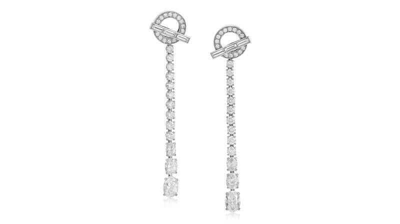 These Hermès earrings feature two brilliant-cut oval diamonds weighing 0.76 and 0.74 carats as well as oval, round, and baguette-cut diamonds accents in 18-karat gold ($12,000-$18,000).