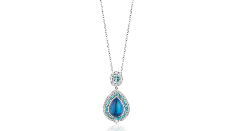 Business/Day Wear, First Place. Niveet Nagpal platinum pendant featuring an 8.12-carat pear-shaped moonstone cabochon accented with Paraiba-type tourmalines (0.86 total carats) and diamonds (0.96 total carats)