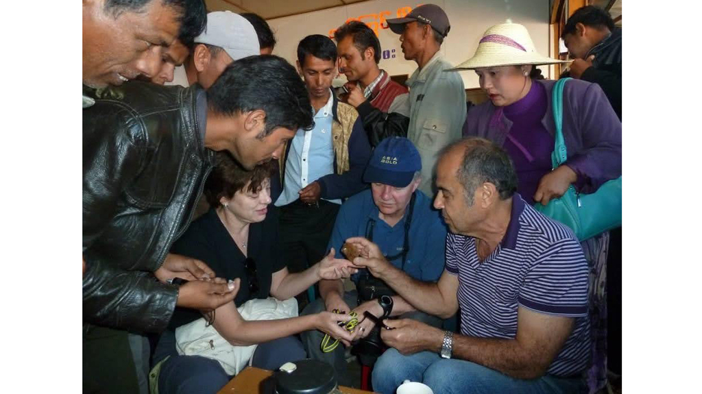 Habib enjoyed traveling the world to buy and sell gemstones. He’s pictured here at bottom right buying stones in Myanmar.