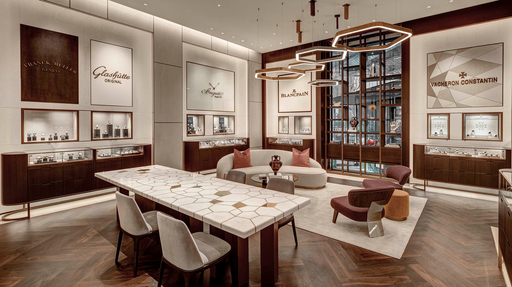 The interior color scheme of the revamped store combines whites, warm neutrals, and dark hues. The interior color scheme of the revamped store combines whites, warm neutrals, and dark hues.