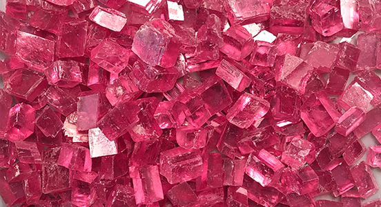 Rough rhodochrosite for faceting (Photo courtesy of Collector’s Edge Minerals Inc.)
