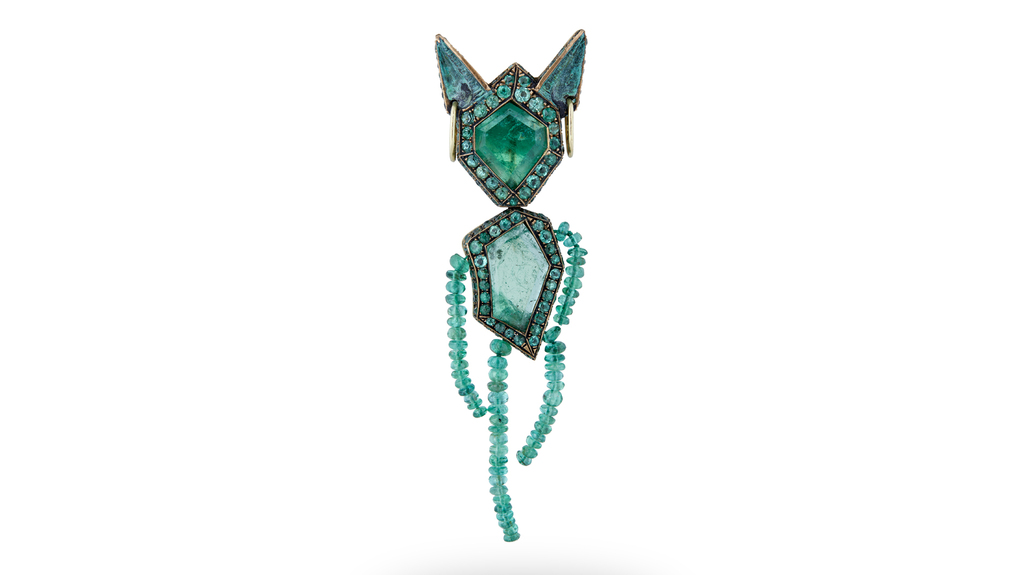 Castro’s “Money Brooch” pendant, featuring Muzo emeralds, was also presented at Sotheby’s “Brilliant & Black” exhibition. (Image courtesy of Sotheby’s)