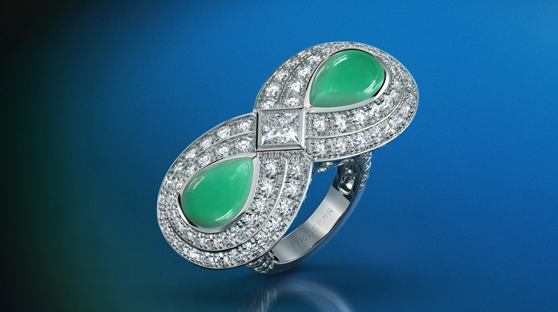 This cocktail ring uses 6.52 carats of diamonds and chrysoprase to form an infinity symbol.