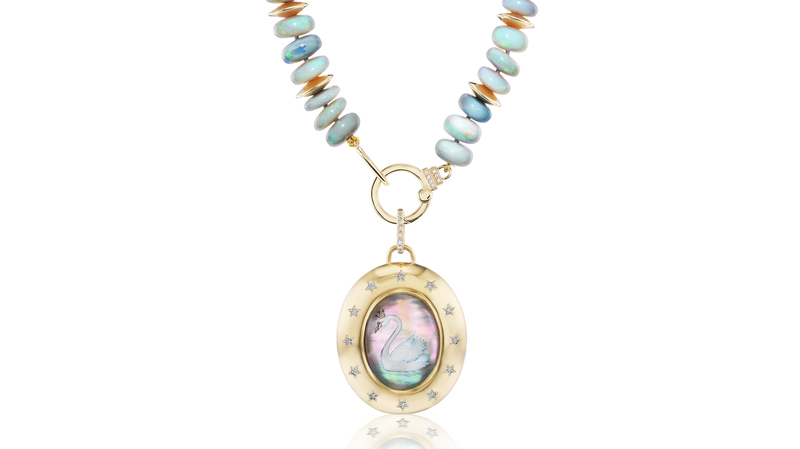 The “Cigno” pendant in 18-karat yellow gold with hand-painted rock crystal cabochon, black mother-of-pearl and diamonds ($6,900) on a one-of-a-kind 18-karat yellow gold and opal bead necklace with diamonds ($6,800). Cigno means swan in Italian.