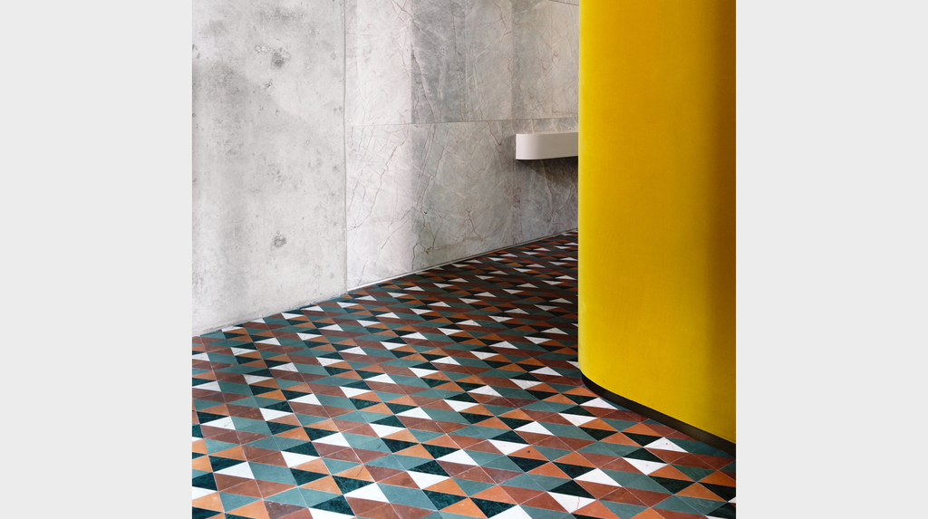 The store’s exquisite threshold features a hand-cut mosaic floor. The store’s exquisite threshold features a hand-cut mosaic floor.