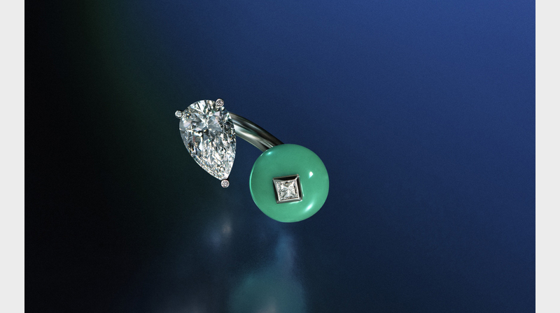 An open ring has 5.9 carats of diamonds mixed with chrysoprase.